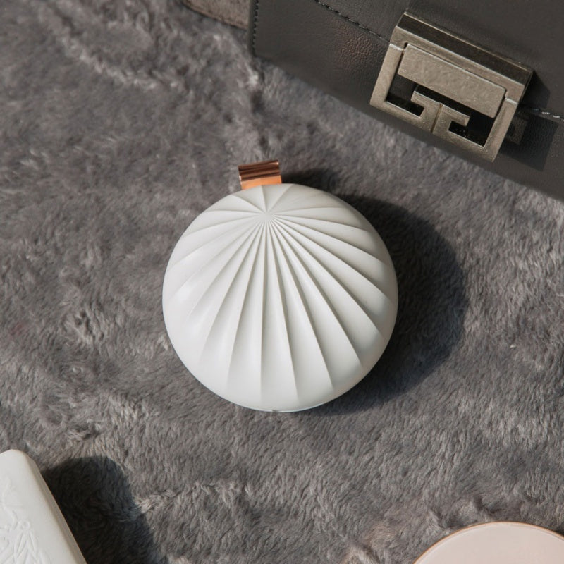 Aroma On-The-Go: Mini Shell Car Diffuser with USB Charging Port